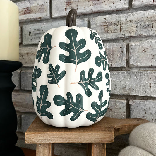 Large artificial pumpkin with painted on fall leaves