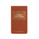 Rust colored buckram memo pad with gold foil postage-stamp pumpkin illustration