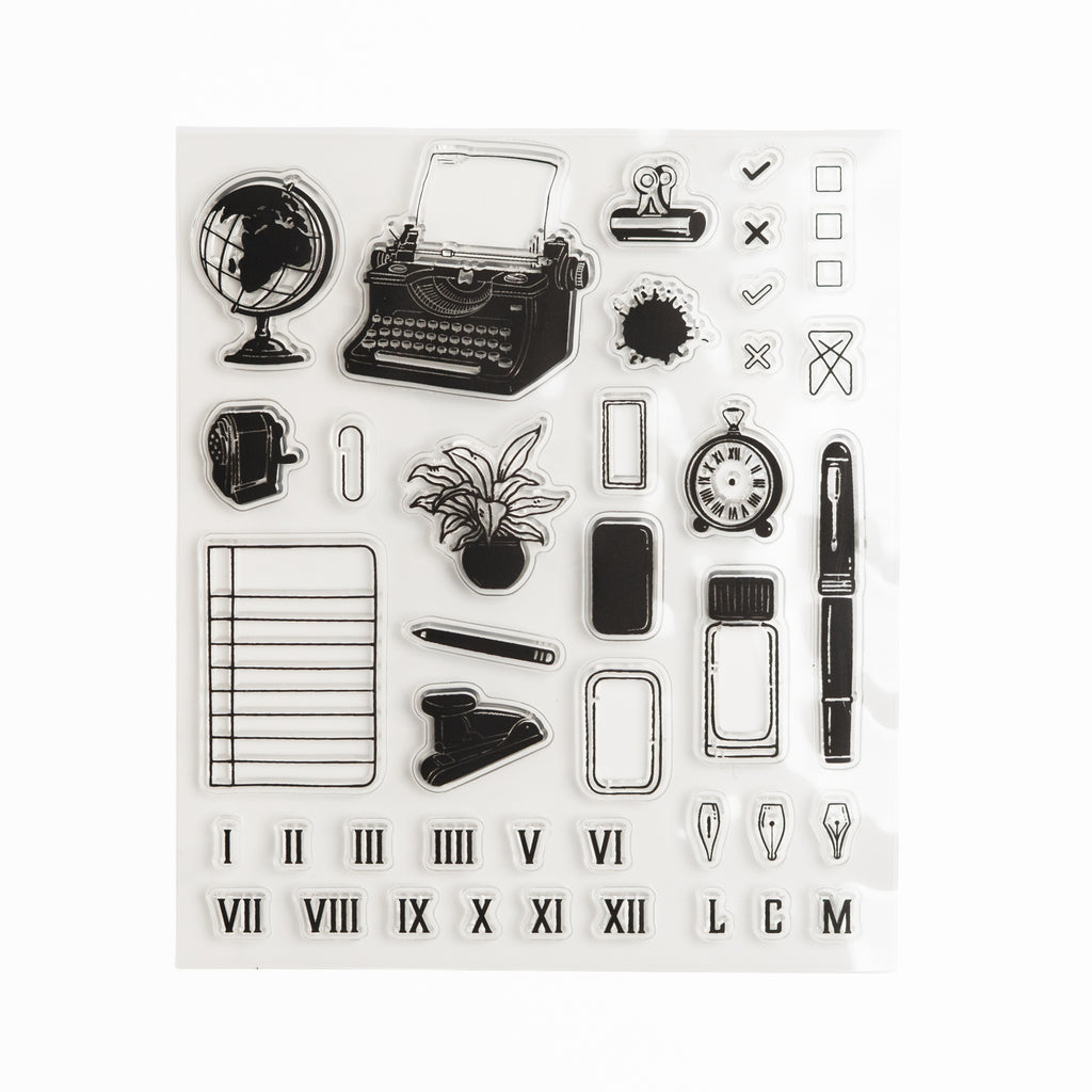 Clear acrylic stamp sheet with typewriter, desk items, and planning-themed illustrations.