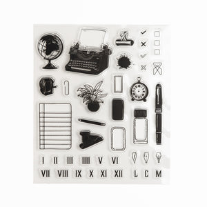 Clear acrylic stamp sheet with typewriter, desk items, and planning-themed illustrations.