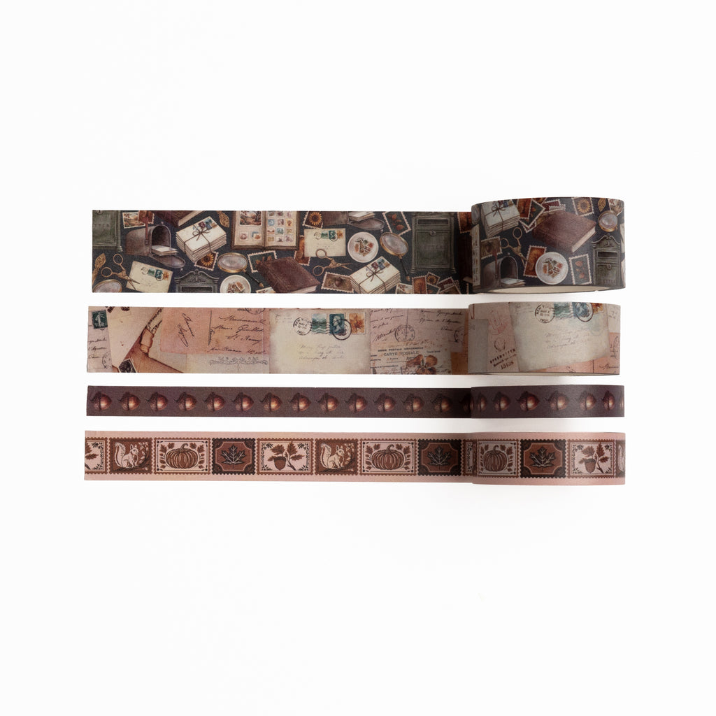 Four rolls of Stamp Collector washi tape with vintage postal and nature illustrations