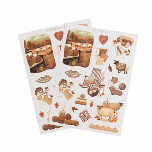 Two sticker sheets with sheep, yarn, and cottagecore countryside illustrations