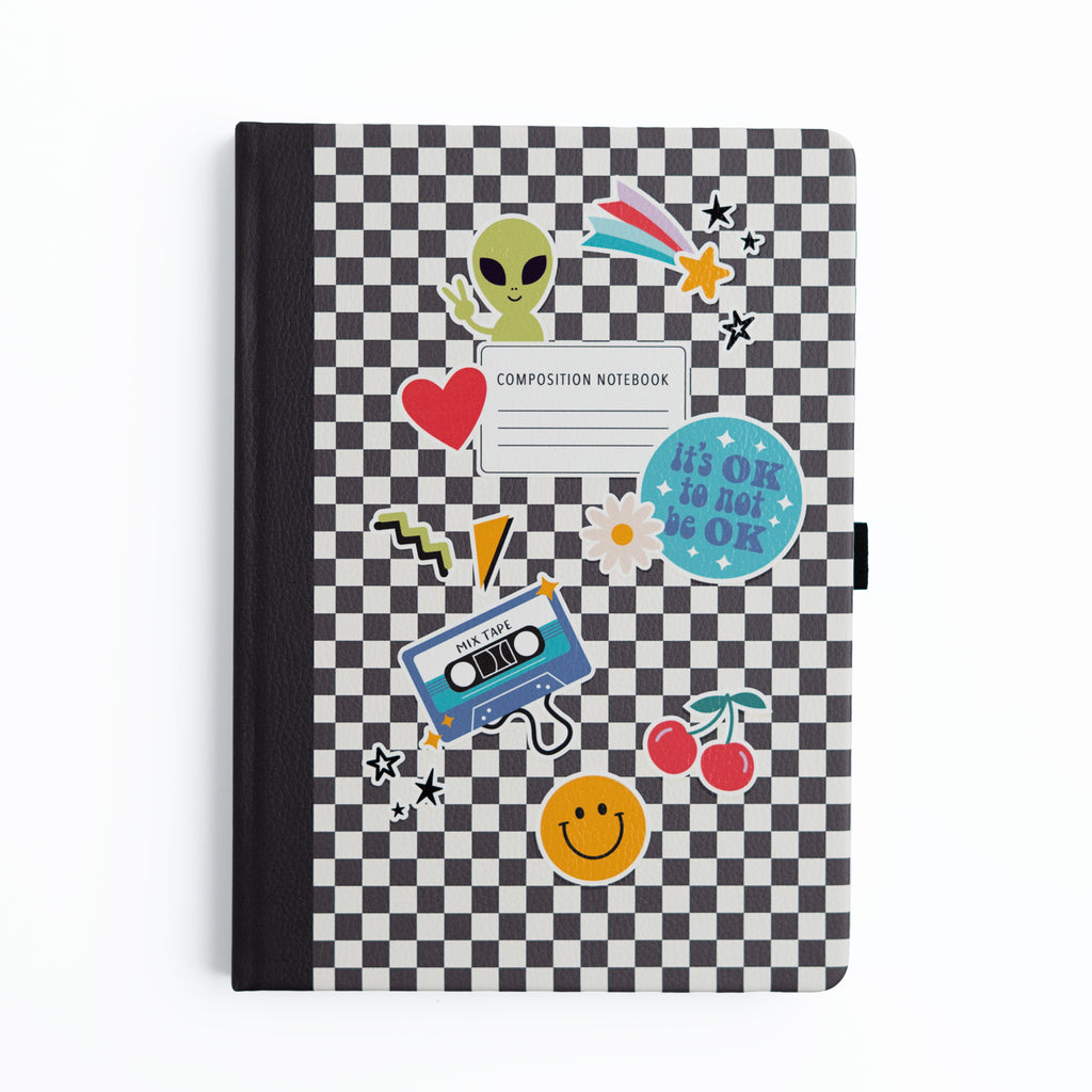 Checkered notebook with colorful stickers on a white background