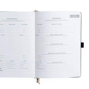 Open notebook with reading statistics and book awards sections on a white background