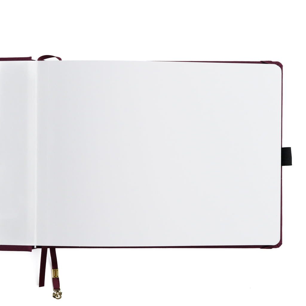 Open notebook with white pages on a white background
