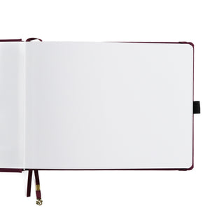 Open notebook with white pages on a white background