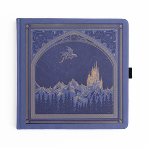 Periwinkle notebook with a castle and dragon design on the cover