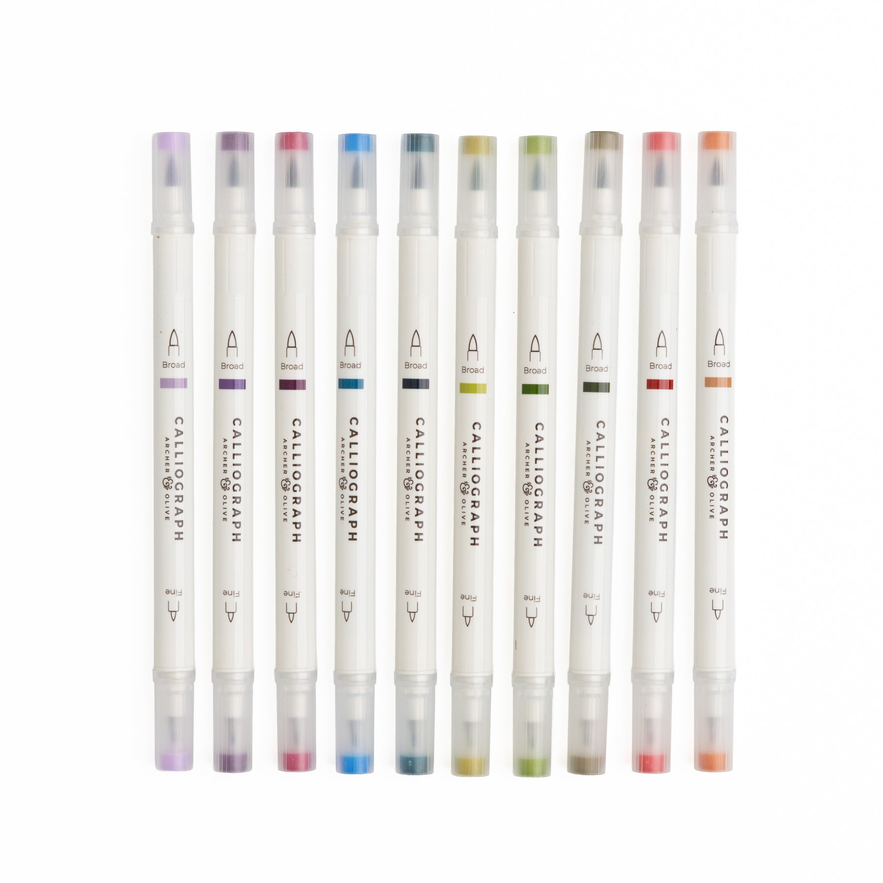 Set of Calligraphic markers with colored caps on a white background