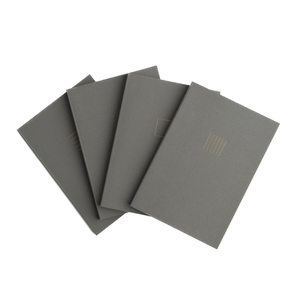 Set of five gray notebooks on a white background