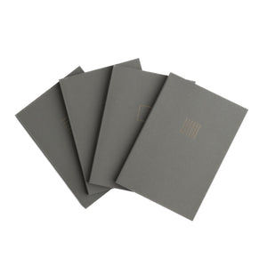 Set of five gray notebooks on a white background