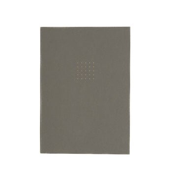 Gray notebook with a gold square design on a white background