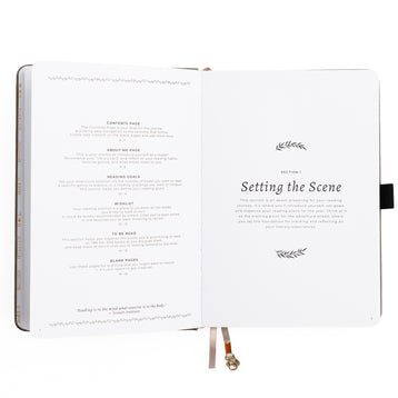 Open book with text and decorative elements on a white background