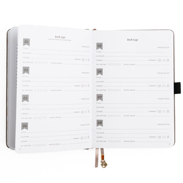 Open notebook with a grid of text and logo design on a white background