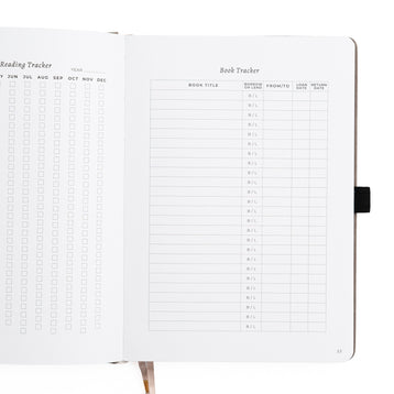 Notebook with reading and book tracker pages on a white background