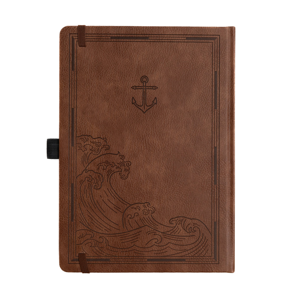 Brown leather notebook with wave and anchor design on a white background